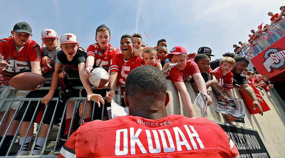 Third Place, Ron Kuntz Sports Photographer of the Year - Barbara J. Perenic / The Columbus DispatchOhio State safety Jeff Okudah signs autographs for young fans following the spring football game at Ohio Stadium in Columbus on Saturday, April 15, 2017. 