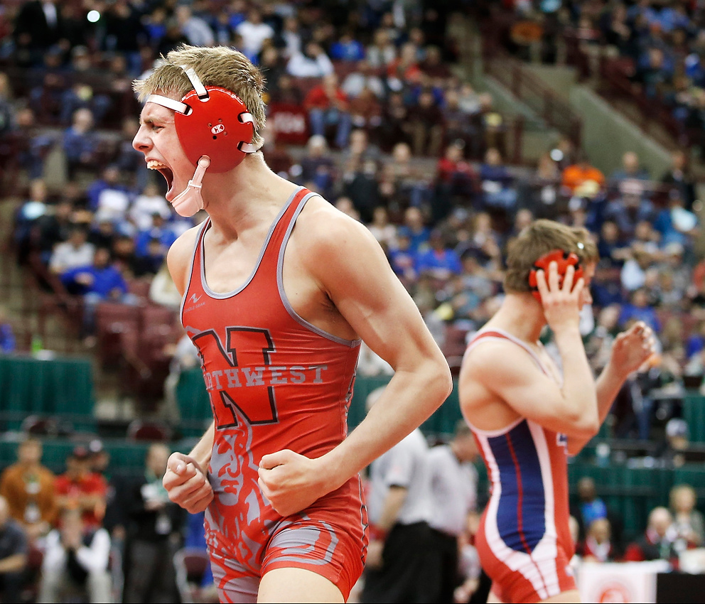 Third Place, Ron Kuntz Sports Photographer of the Year - Barbara J. Perenic / The Columbus DispatchHunter Kosco of Canal Fulton Northwest celebrates a win over Addison Fogle of Newark Licking Valley at 126 lbs. in Division II during Friday's OHSAA championship wrestling tournament at Value City Arena in Columbus on March 10, 2017. 