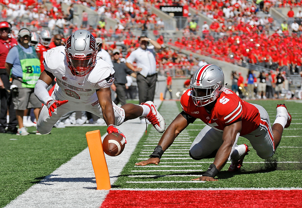 Third Place, Ron Kuntz Sports Photographer of the Year - Barbara J. Perenic / The Columbus DispatchUNLV Rebels running back Lexington Thomas (3) scores a touchdown while defended by Ohio State Buckeyes linebacker Baron Browning (5) during the second quarter of Saturday's NCAA Division I football game at Ohio Stadium in Columbus on September 23, 2017. 
