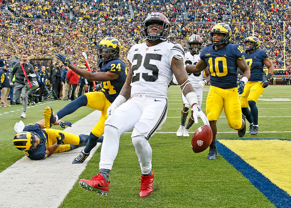 Third Place, Ron Kuntz Sports Photographer of the Year - Barbara J. Perenic / The Columbus DispatchOhio State Buckeyes running back Mike Weber (25) dances into the end zone for a touchdown during the second half of Saturday's NCAA Division I football game against the Michigan Wolverines at Michigan Stadium in Ann Arbor on November 25, 2017. Ohio State won the game 31-20. 