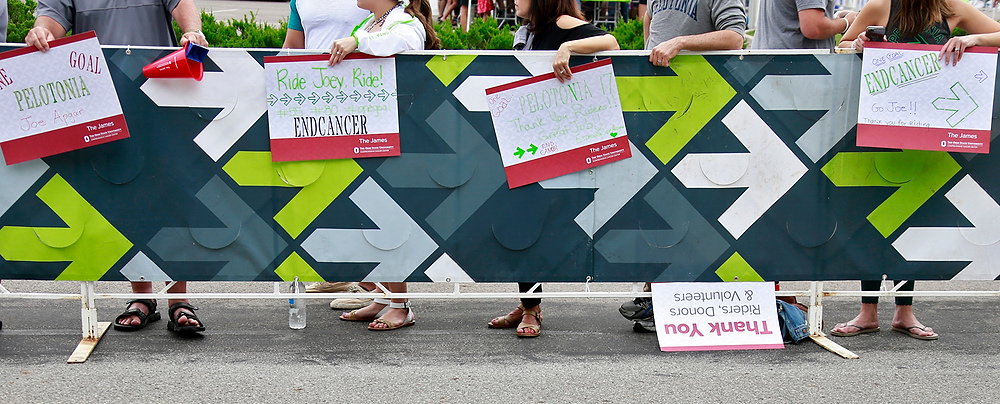 Third Place, Ron Kuntz Sports Photographer of the Year - Barbara J. Perenic / The Columbus DispatchSpectators hold handmade signs while waiting for riders to arrive at the 180-mile Pelotonia finish line in New Albany.