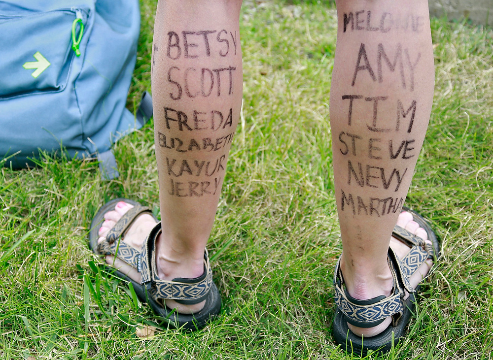 Third Place, Ron Kuntz Sports Photographer of the Year - Barbara J. Perenic / The Columbus DispatchNames of a rider's honorees are written on her legs are the Pelotonia finish line in New Albany.