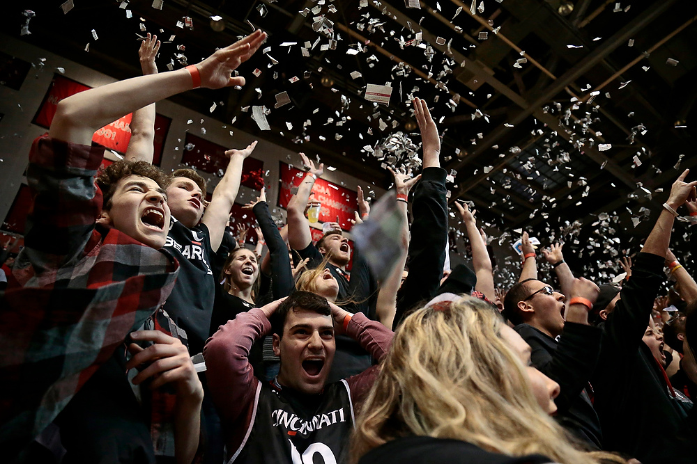 Award of Excellence, Ron Kuntz Sports Photographer of the Year - Sam Greene / The Cincinnati EnquirerThe Cincinnati Bearcats student section celebrates as UC scores its first basket of the game in the 84th annual Crosstown Shoutout game between the Cincinnati Bearcats and the Xavier Musketeers at UC's Fifth Third Arena in Cincinnati on Thursday, Jan. 26, 2017.