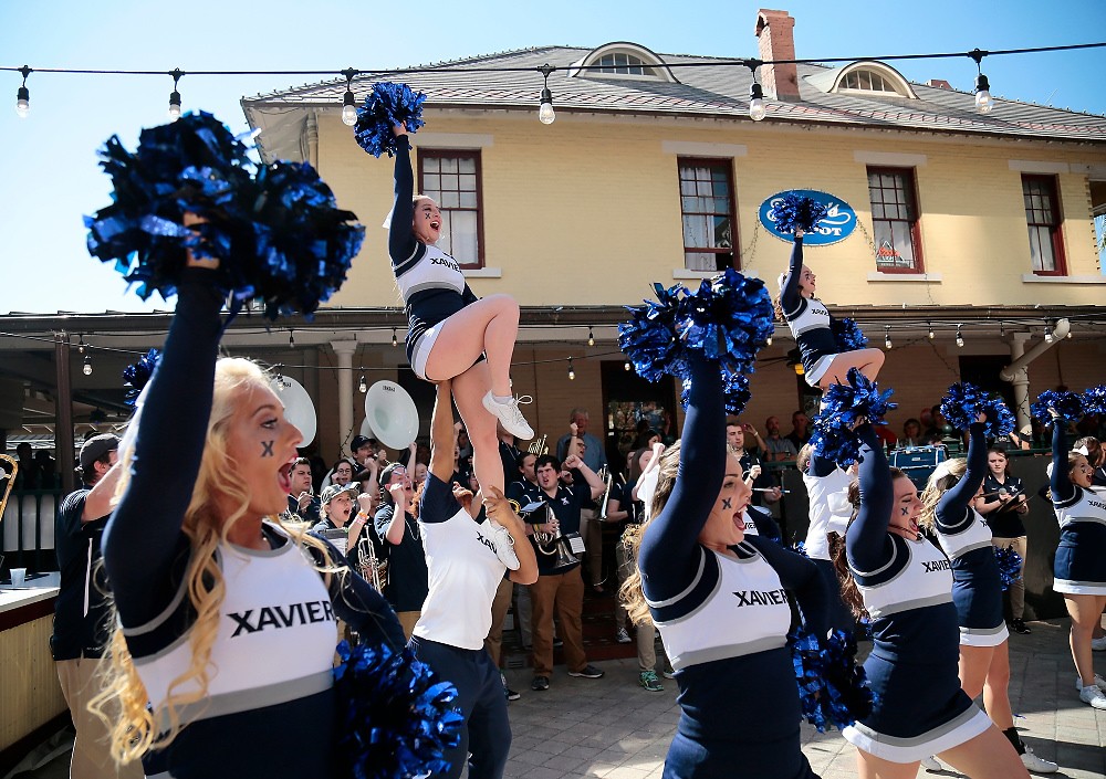Award of Excellence, Ron Kuntz Sports Photographer of the Year - Sam Greene / The Cincinnati EnquirerThe Xavier band and cheerleaders perform during a pep rally at Ferg's in downtown Orlando, Fla., on Saturday, March 18, 2017. The 11-seeded Musketeers take on the 3-seeded Florida State Seminoles for a berth in the Sweet 16.