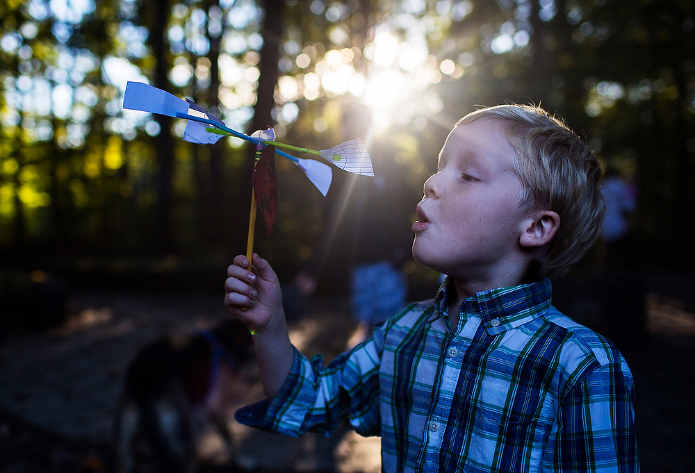 First Place, Chuck Scott Student Photographer of the Year - Erin Clark / Ohio UniversityLinus, 5, plays with a homemade anemometer he created to measure the wind speed.