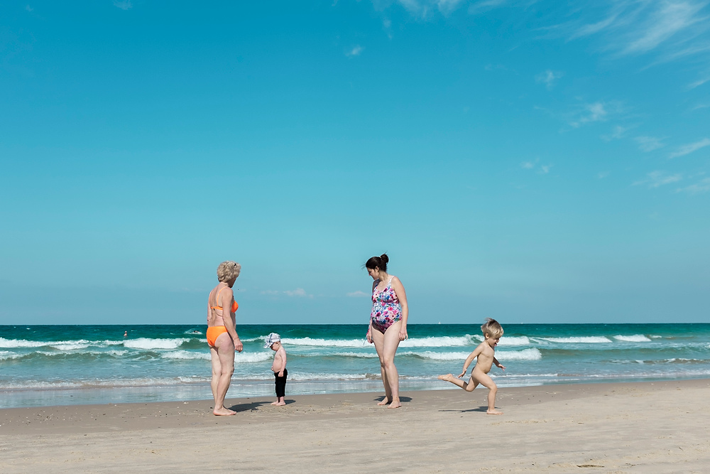 Second Place, Chuck Scott Student Photographer of the Year - Liz Moughon / Ohio UniversityA family relaxes on a Tel Aviv beach.
