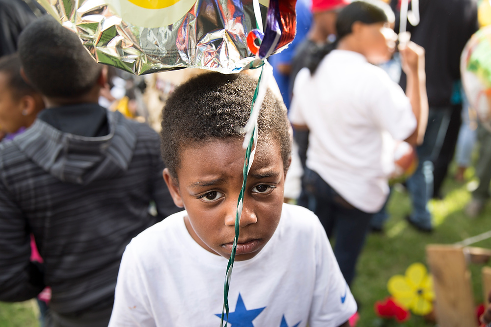 Second Place, Chuck Scott Student Photographer of the Year - Liz Moughon / Ohio UniversityZo White holds onto a balloon to release in memorial of Dequante Hobbs Jr., 7, who was tragically shot by a stray bullet through his kitchen window while eating cake for his first grade graduation.