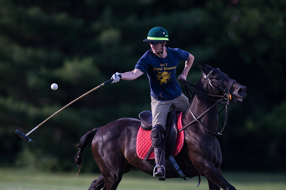 Second Place, Chuck Scott Student Photographer of the Year - Liz Moughon / Ohio UniversitySam Walker attempts to hit the ball during polo practice. Walker started playing with his father two years, and polo has become a way for them to bond. At 25 he can be on equal footing with his father, 54, and they both have the same passion for the sport.