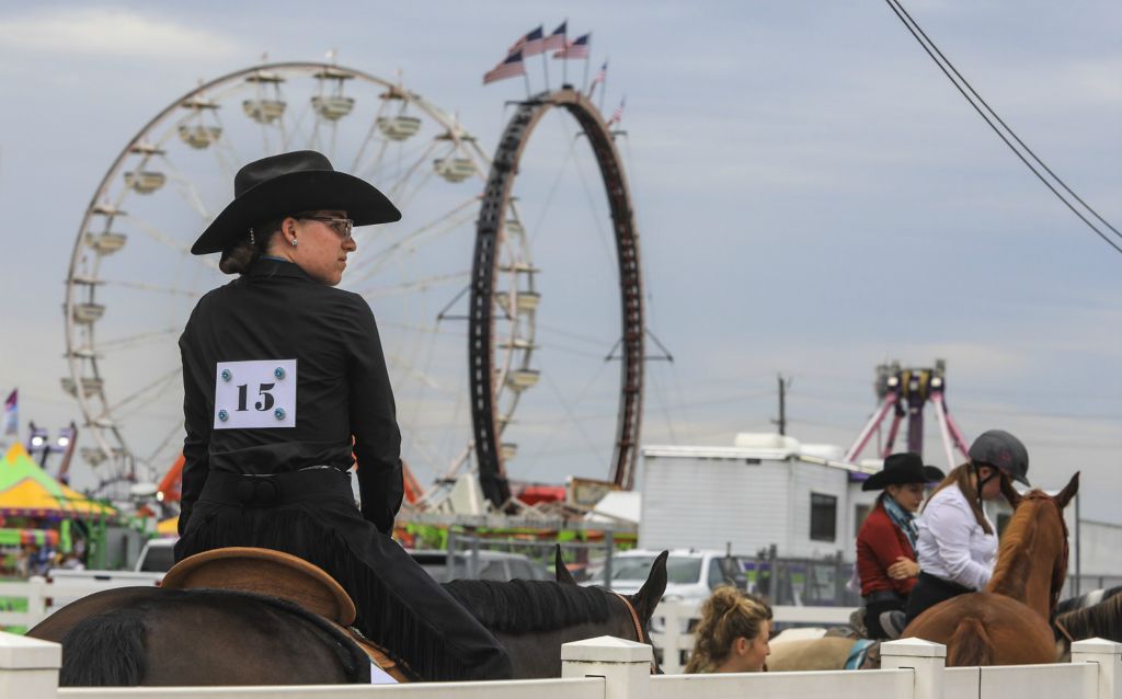 August - Story - 1st place - Julianna Stratton, 18, of Dearborn, Michigan, rides her quarter horse “Jettin2Vegas” at the Monroe County Fair in Monroe, Michigan.   (Jeremy Wadsworth / The Blade)