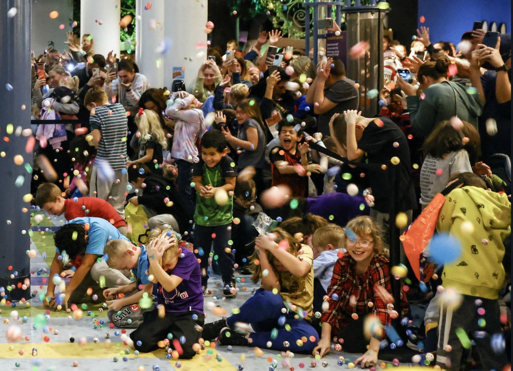 December - General News - 3rd place - Children take cover as 23,000 bouncy balls are dropped at 2:23 pm during the New Year’s Eve EVE Bouncy Ball Drop at Imagination Station in Toledo.  (Jeremy Wadsworth / The Blade)