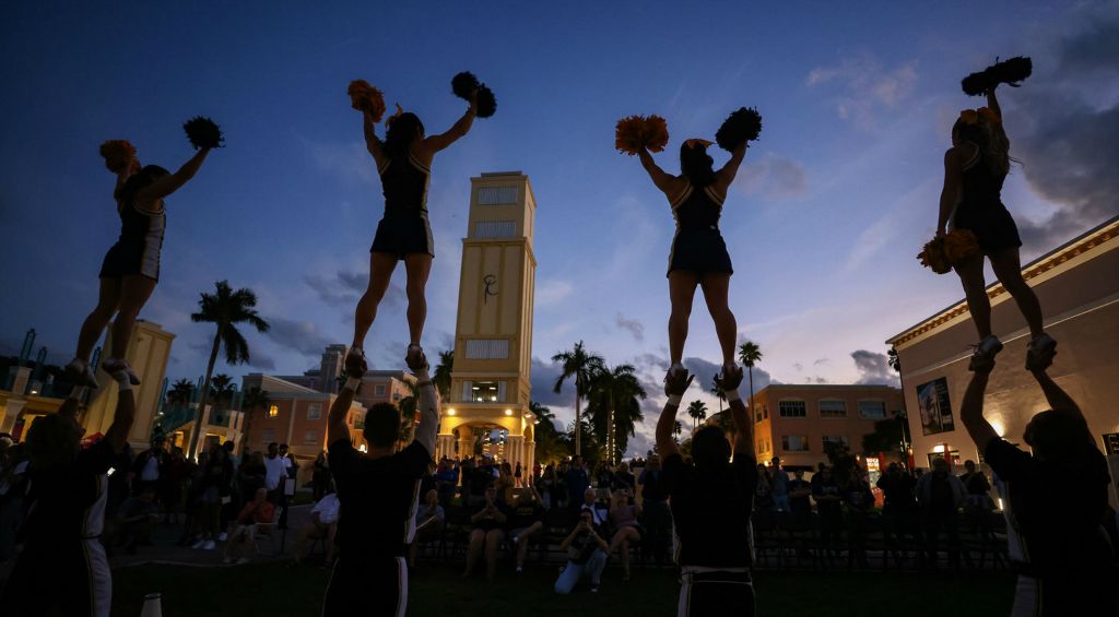 December - Sports Feature - HM - University of Toledo cheerleaders perform during a pep rally for the Boca Raton Bowl at the Mizner Park Amphitheater in Boca Raton, Florida.  (Jeremy Wadsweorth / The Blade)