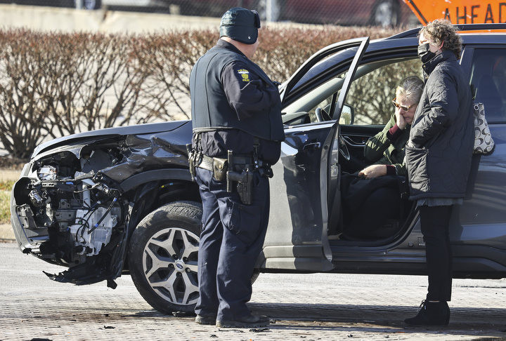 January - Spot News - 1st place - A woman reacts to being involved in a two car accident at the intersection of Monroe Street and 14th Street in Toledo.  (Jeremy Wadsworth / The Blade)