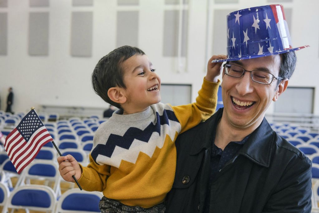March - General News - 1st place - Mohammad Pourshams (right)noriginally from Iran plays with his son Daniel, 3, after becoming a US citizen during a Naturalization Ceremony at St. Rose School in Perrysburg. (Jeremy Wadsworth / The Blade)
