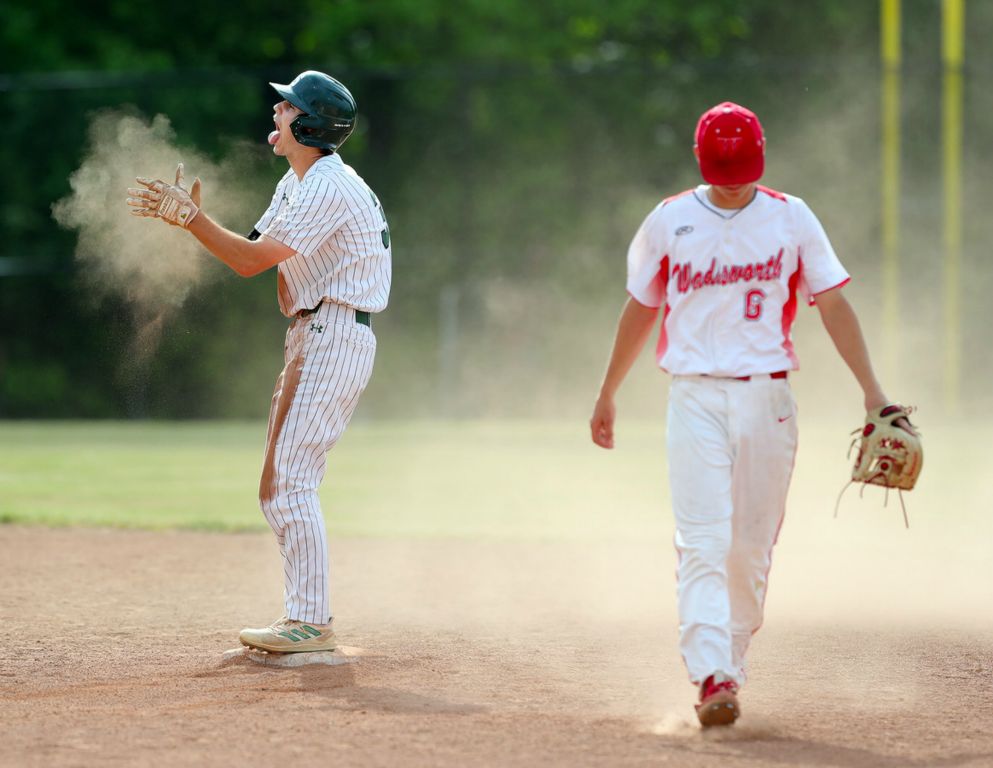 May - Sports Feature - HM - Strongsville Aidan Cunningham (left) celebrates at second base as Wadsworth’s Skyler Kries hangs his head during the seventh inning of a Division I district championship game at Strongsville High School. (Jeff Lange - Akron Beacon Journal)  