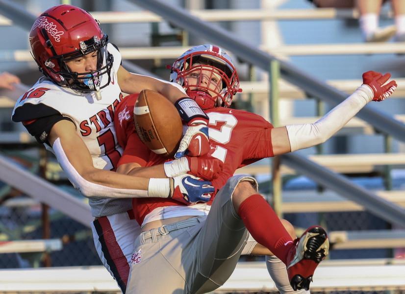 August - Sports - 2nd place - Cardinal Stritch wide receiver Nathan Frontline (left) makes a catch against  St. Joseph Central Catholic linebacker Oliver Wright during a game at Don Paul Stadium in Fremont. (Jeremy Wadsworth / The Blade)