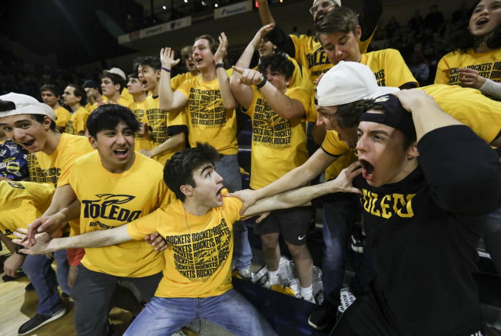  Sports Feature - 1st place - Nate Simpson (center) and the rest of the Rowdy Row react to a dunk during a men’s basketball game at the University of Toledo’s Savage Arena. Toledo defeated Akron, 72- 64.  (Rebecca Benson / The Blade)}