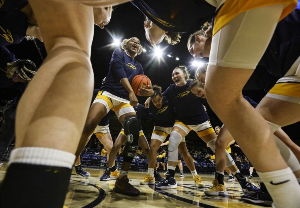  Sports Feature - HM - Toledo’s Soleil Barnes leads the team in a chant before the start of a women’s MAC-SBC challenge game at the University of Toledo’s Savage Arena. (Rebecca Benson / The Blade)}