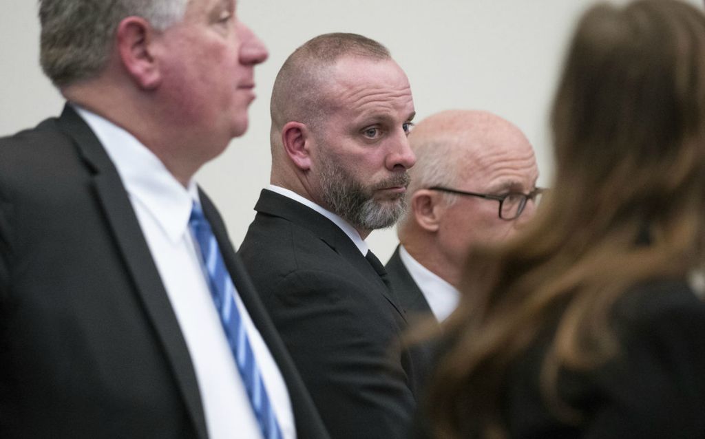  Story - 1st place - Michael Jason Meade stands with Defense Attorneys Mark Collins, Kaitlyn Stephens and Steve Nolderwhile they wait for court to begin in the trial of Michael Jason Meade at the Franklin County’s Common Pleas Court. (Brooke LaValley / The Columbus Dispatch)}